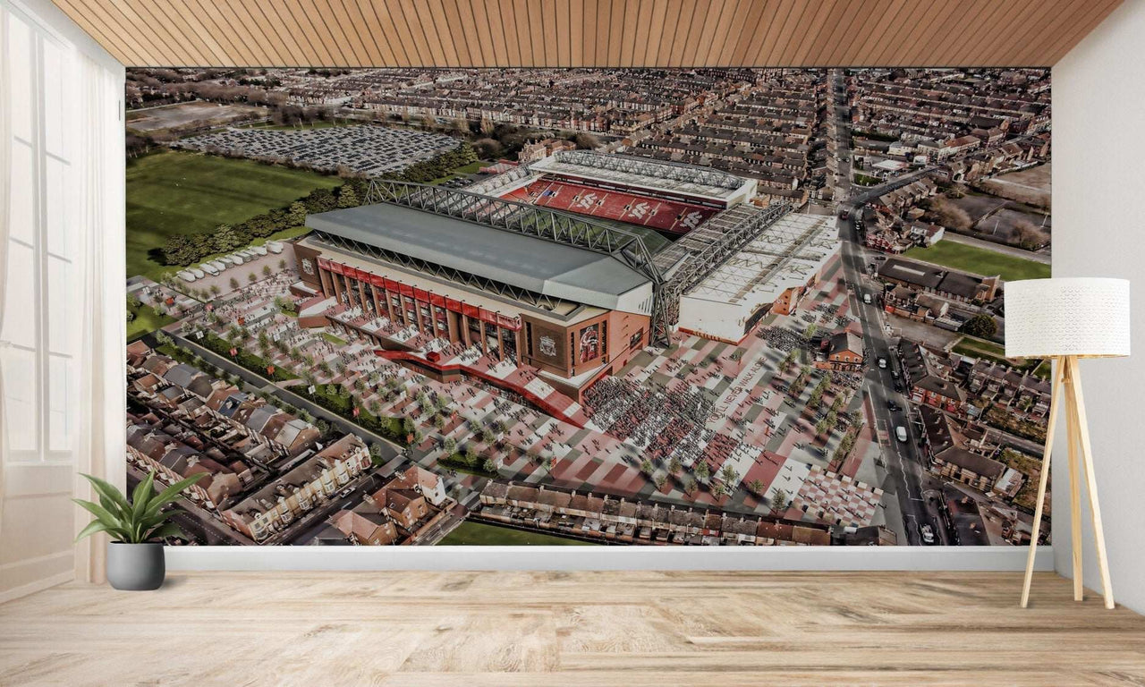 Vue aérienne d’un grand stade de football entouré d’un développement urbain.