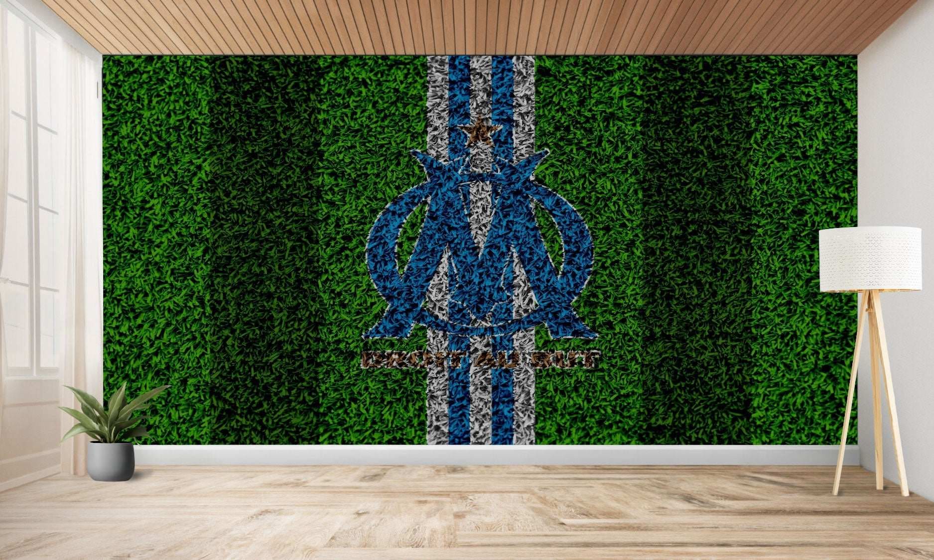Peinture murale à texture d’herbe avec un logo d’équipe sportive.