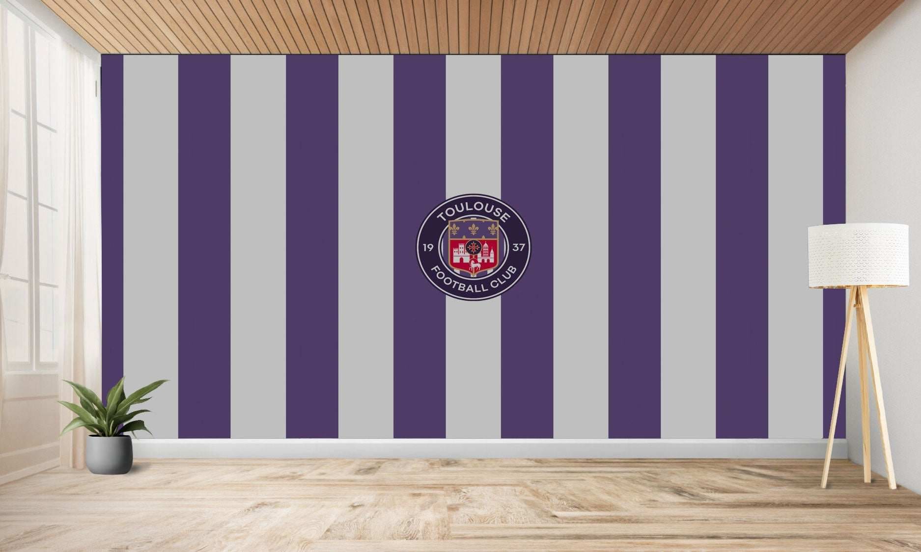 Mur rayé avec le logo du Toulouse Football Club.