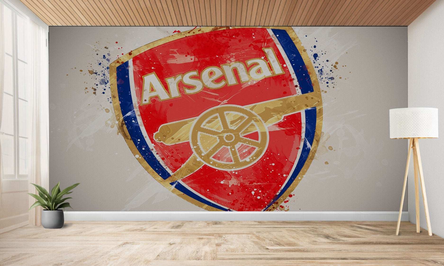 Une grande représentation artistique de l’écusson du club de football d’Arsenal sur un mur.