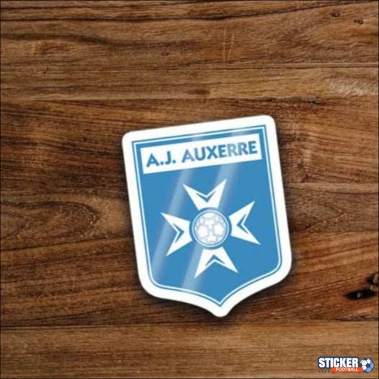 Un autocollant bleu et blanc en forme de bouclier avec un ballon de football.